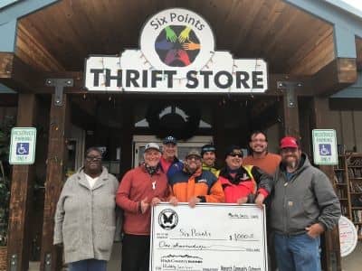 Six Points receives a check from Monarch Community Outreach