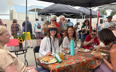 Smiling picnic-goers at the 2025 Annual Six Points Community Picnic.